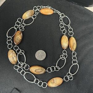 Silver chain and polished shell Necklace or belt you decide. Length 35”